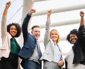 group of people raising right hand