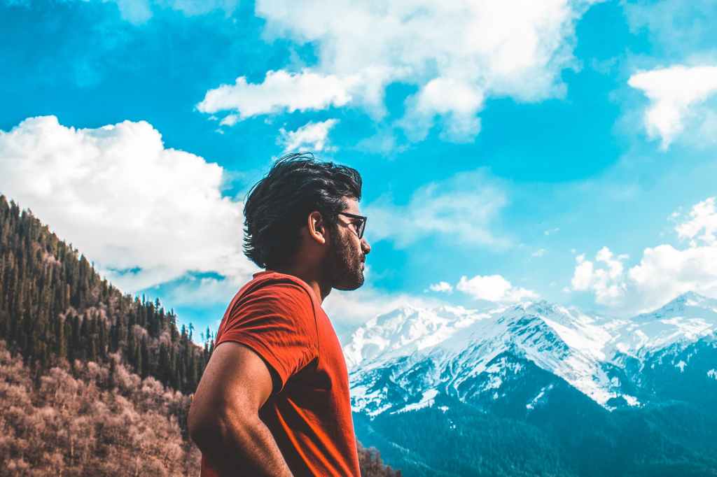 man standing on mountain