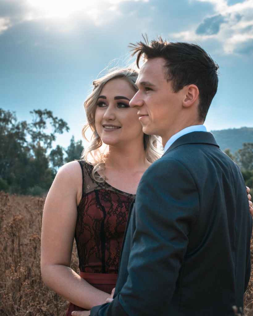 man and woman hugging together