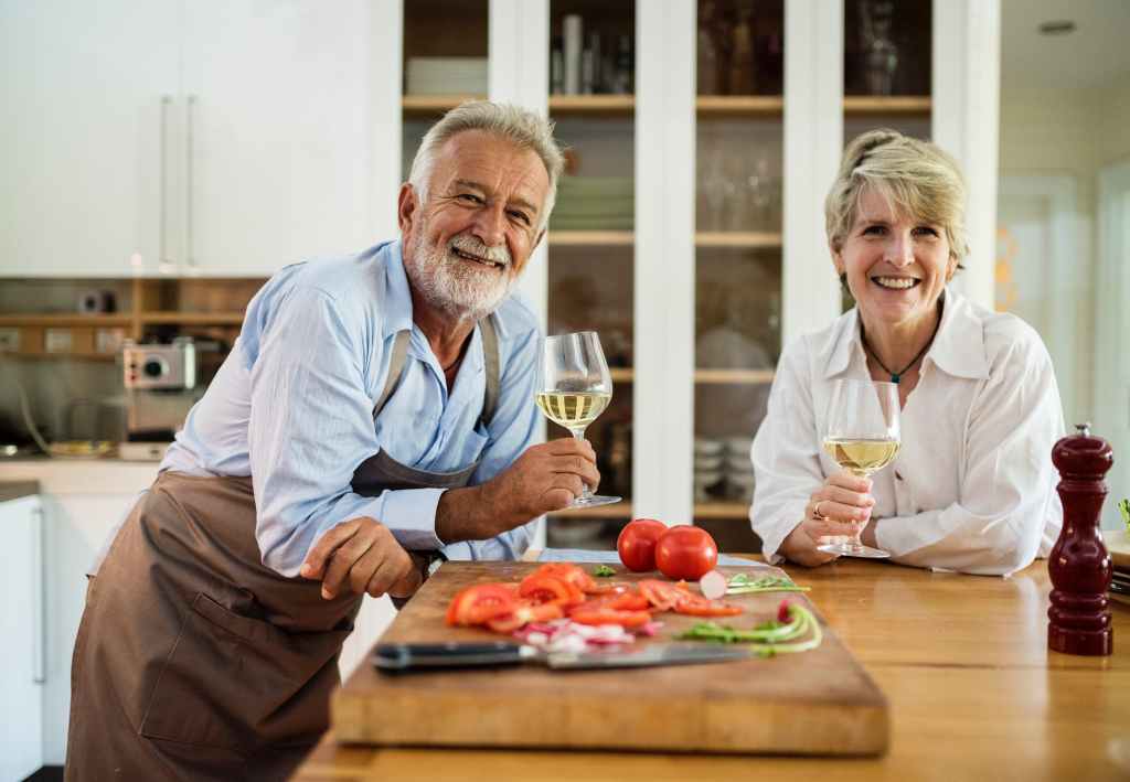 man and woman holding wine glasses